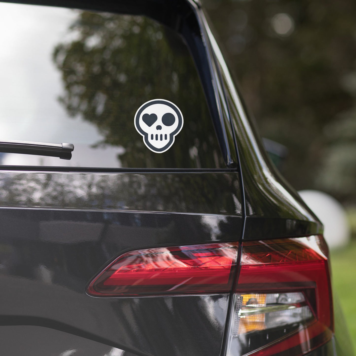A 5.5″×5.5″ the survivors mark sticker (free w/ any 1 item _) (_add to cart) from Phobea with a heart eye skull logo