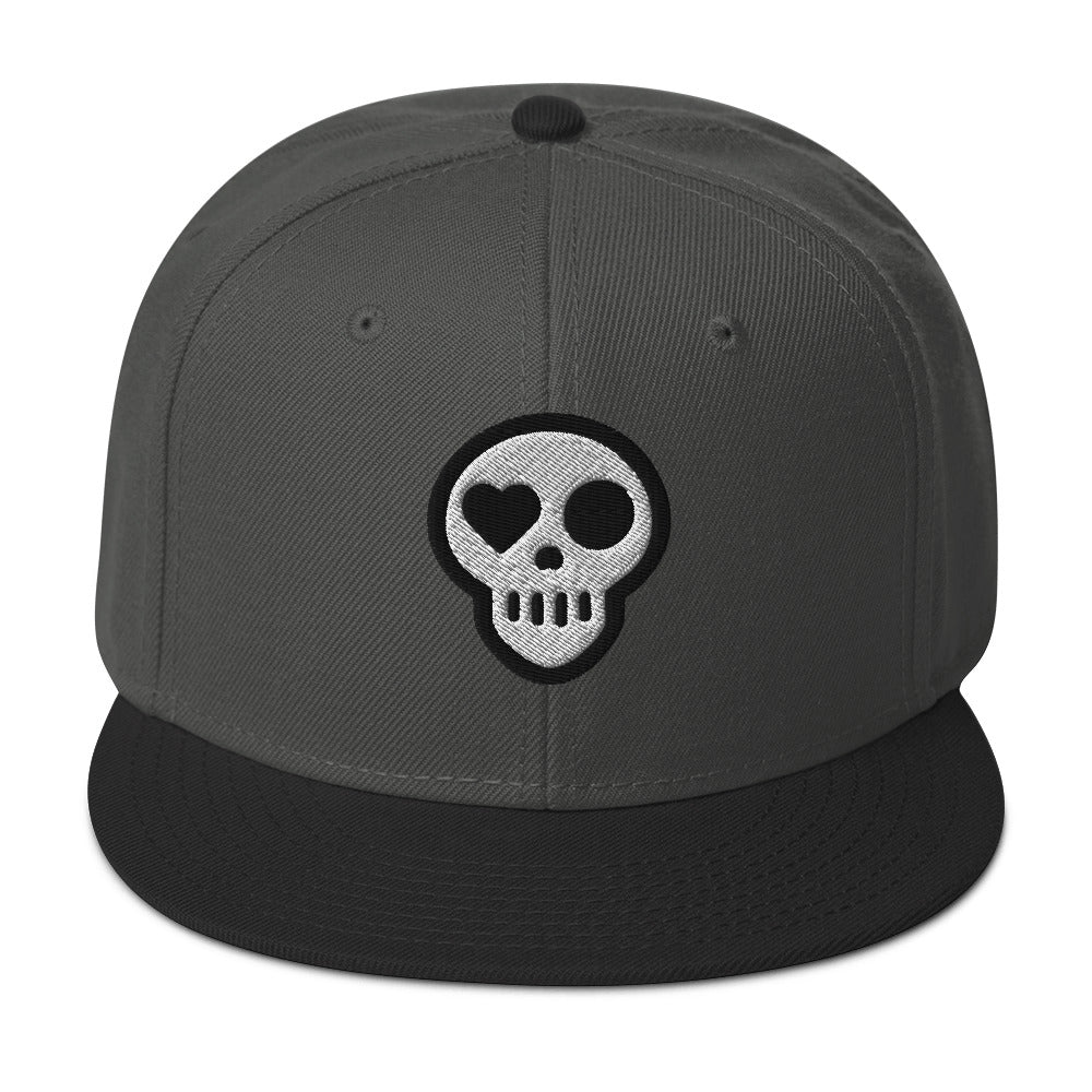 A Black / Charcoal gray / Charcoal gray hats_ghost snap from Phobea with a heart eye skull logo