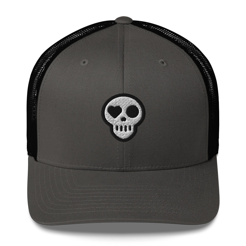 A Charcoal/ Black Hats - Nomad Trucker from Phobea with a heart eye skull logo