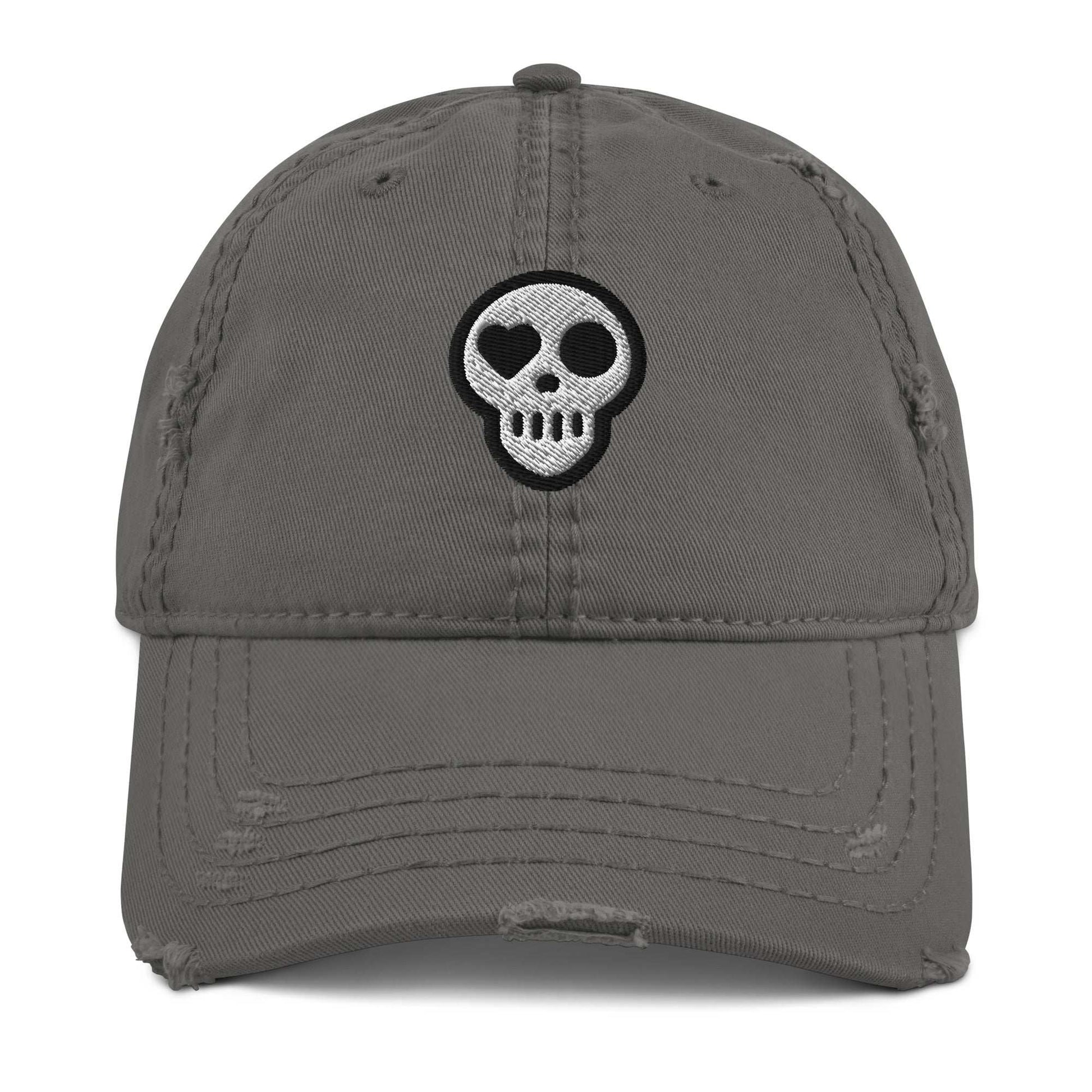 A Charcoal Grey Hats - Requiem Cap from Phobea with a heart eye skull logo