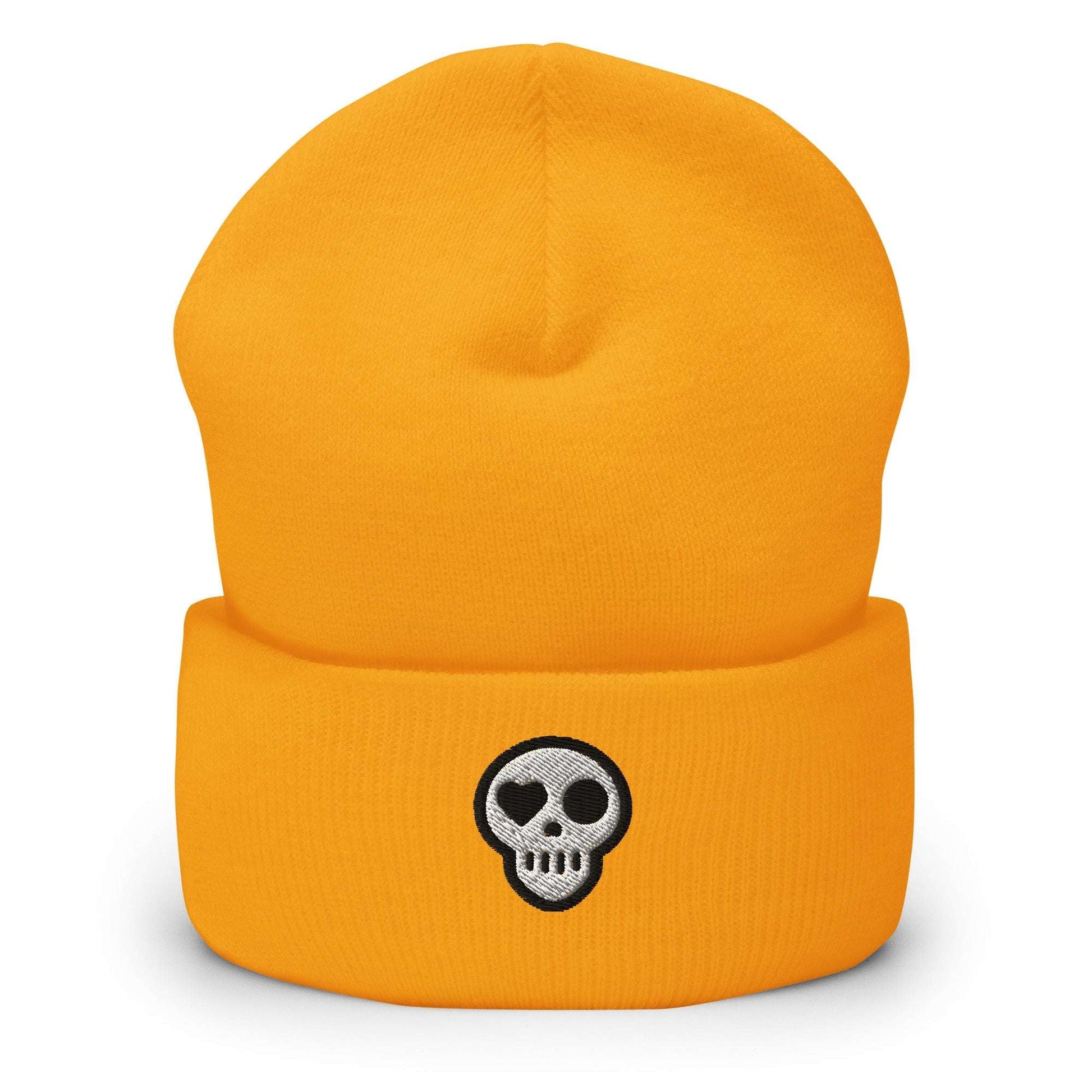 A Gold Hats - Hearth Beanie from Phobea with a heart eye skull logo