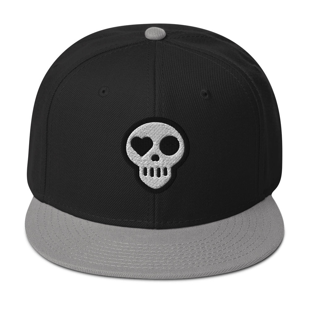 A Gray / Black / Black hats_ghost snap from Phobea with a heart eye skull logo