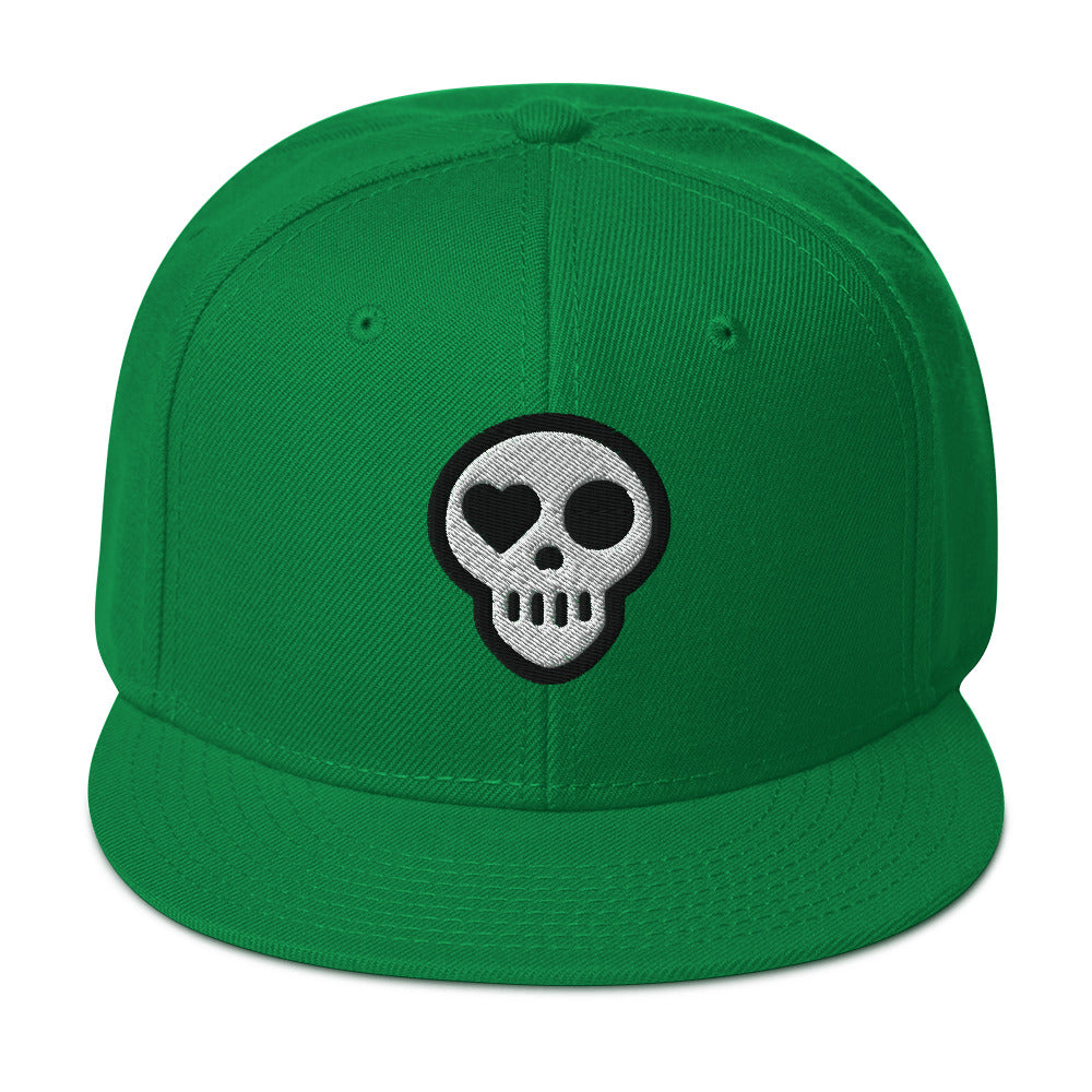 A Kelly Green hats_ghost snap from Phobea with a heart eye skull logo